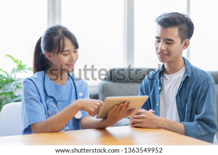 female medicine doctor explains to patient diagnosis pointing with tablets to x-ray picture. Patients listening carefully specialist recommendations. Medical care concept. Radiologist traumatologist