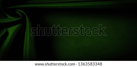 texture, background, pattern. green silk fabric panoramic photo. Silk Duke mood Satin is a beautiful and royal silk fabric. It has a shimmering shine,