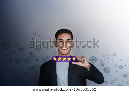 Customer Experience Concept. Young Businessman with Happy Face Showing his Five Star Services Rating Satisfaction. Happy Client's Feedback and Online Review. Surrounded by Network Icons