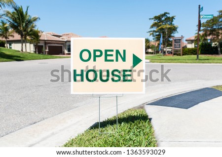 Open House sign in a Florida golf community for luxury condos.