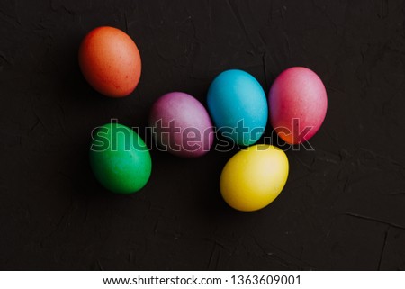 Colored easter eggs on a black background