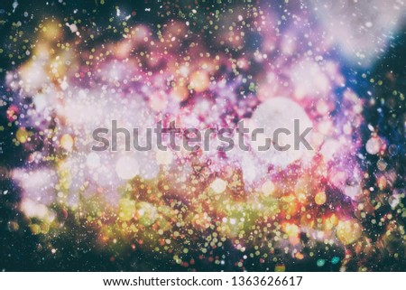 abstract blurred of blue and silver glittering shine bulbs lights background:blur of Christmas wallpaper decorations concept.xmas holiday festival backdrop:sparkle circle lit celebrations display 