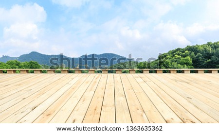 Wooden floor platform and green mountains background in Hangzhou 