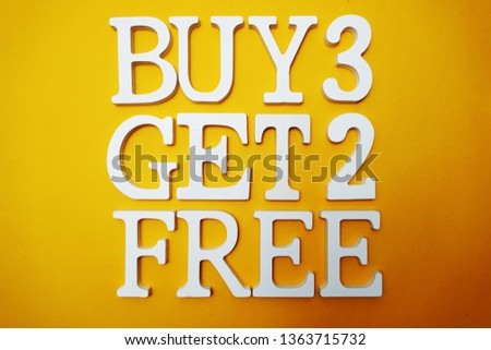 Buy three get two Free Sale Promotion on Yellow background