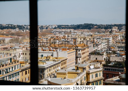 View through the window - aerial cityscape of Rome, Italy.