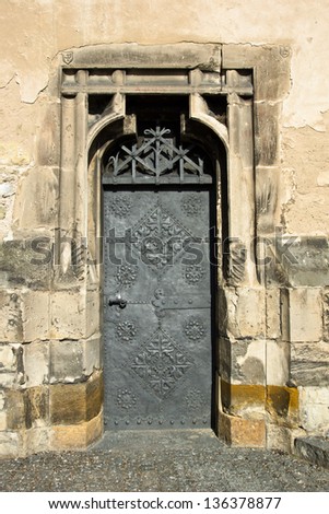 Old side church door with ornament