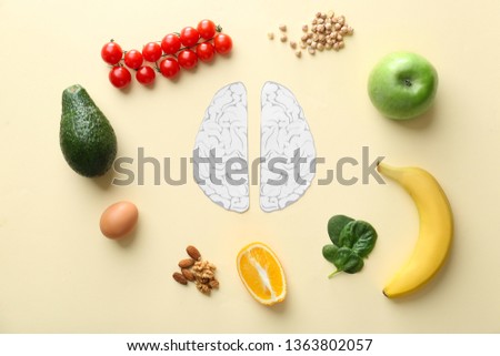 Human brains with different healthy products on color background Royalty-Free Stock Photo #1363802057