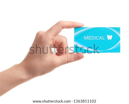 Woman holding business card isolated on white, closeup. Dental medical service