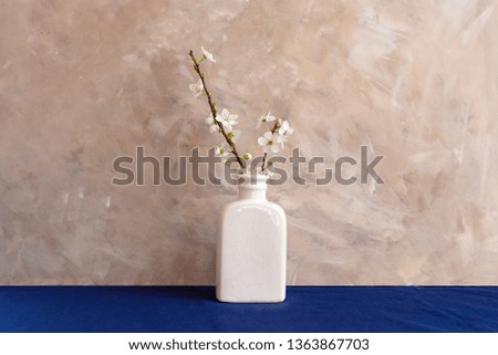 Spring white flowers in a vase. Still life. Image
