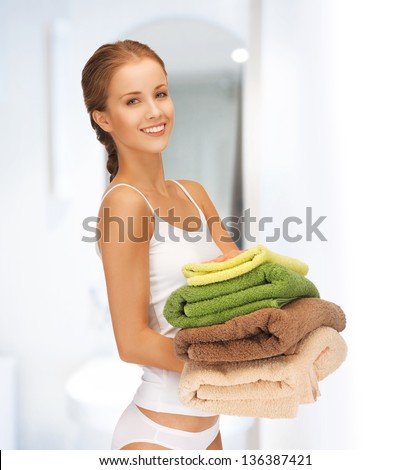 bright picture of lovely housewife with colorful towels