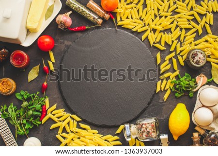 pasta, penne and sauce (set of ingredients). top food background. copy space