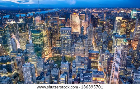 Beautiful New York City skyline with urban skyscrapers at sunset. Royalty-Free Stock Photo #136395701