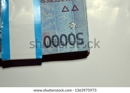Fifty thousand Rupiah in money with a white background