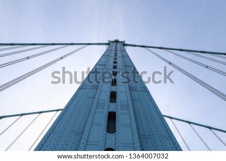 Close up view of metal tower construction of Ben Franklin  Bridge against blue sky. Suspension bridge across Delaware river, Pennsylvania, USA