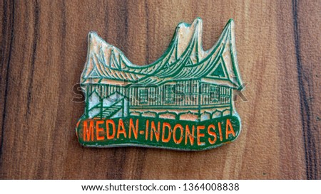Fridge magnet as souvenir from Medan,Indonesia  on wooden magnet
