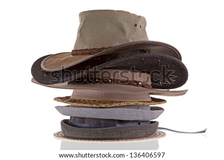 a stack of hat variety on white background