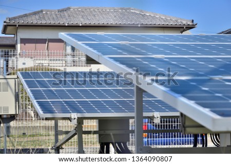 Solar panels in vacant land Royalty-Free Stock Photo #1364090807