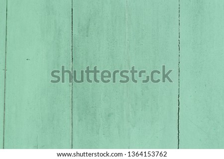 Faded green or blue wooden background with some cracked spots and vertical pattern on it, Wooden background was painted faded green or blue