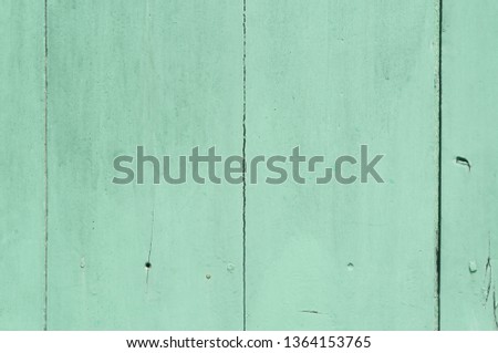 Faded green or blue wooden background with some cracked spots and vertical pattern on it, Wooden background was painted faded green or blue