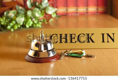 Vintage old hotel bell on the table Royalty-Free Stock Photo #136417715