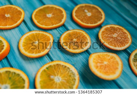 Fruit pattern of fresh orange tangerine  on blue wooden background Flat lay Top view Pop art design and creative summer concept Citrus in minimal style