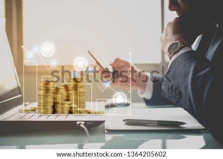 Investor checking stock market invest with coins visual screen