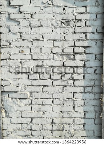 Textured abstract background old brick white wall dirty vintage in  sunny day