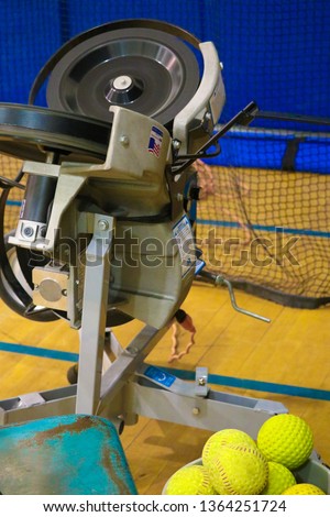 Softball Equipment in Gym Royalty-Free Stock Photo #1364251724