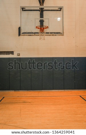 Highschool Gym Basketball Hoop Royalty-Free Stock Photo #1364259041
