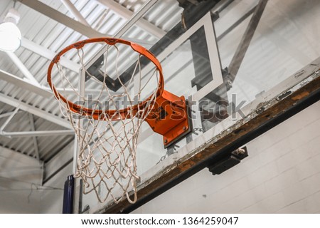 Highschool Gym Basketball Hoop Royalty-Free Stock Photo #1364259047