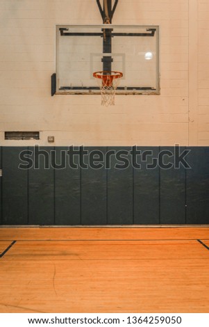 Highschool Gym Basketball Hoop Royalty-Free Stock Photo #1364259050