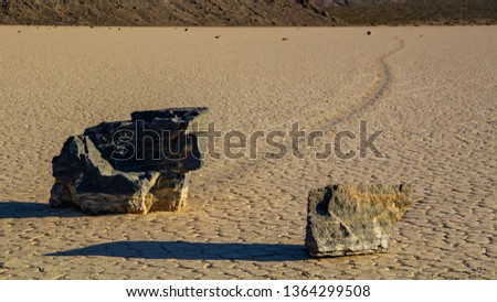 Moving Stones at the Racetrack Playa in Death Valley California with a depth of field