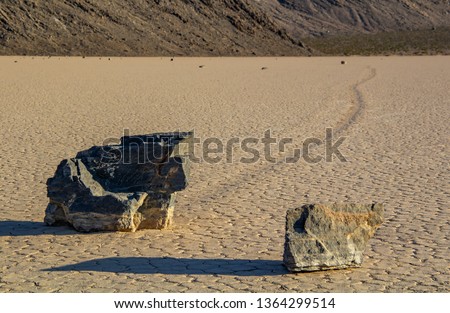 Moving Stones at the Racetrack Playa in Death Valley California with a depth of field