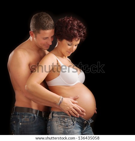 Hands of pregnant woman and her husband