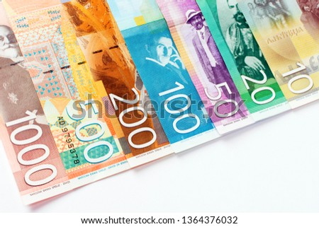 Serbian dinar banknotes as an European paper currency, cash money on white background.