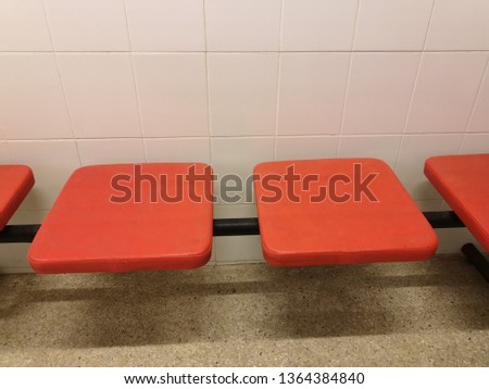 Red chair on the floor on the toilet room