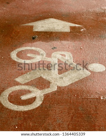 Bicycle with driver sign painted on the floor with arrow