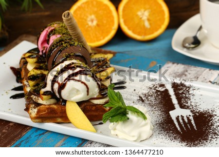 Mixed fruits waffle with ice cream on chocolate lava