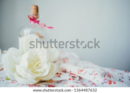 Cute gentle background with flower and fabric. Beauty template 