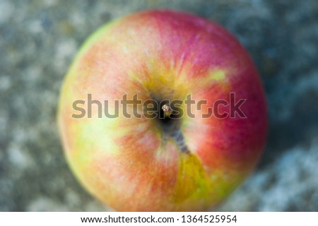 Red single apple against white background top down view stock footage