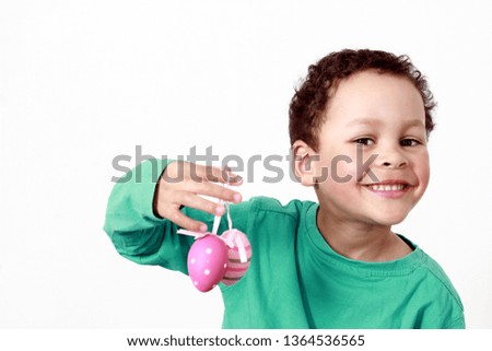 little boy with sweet chocolate Easter eggs stock photo