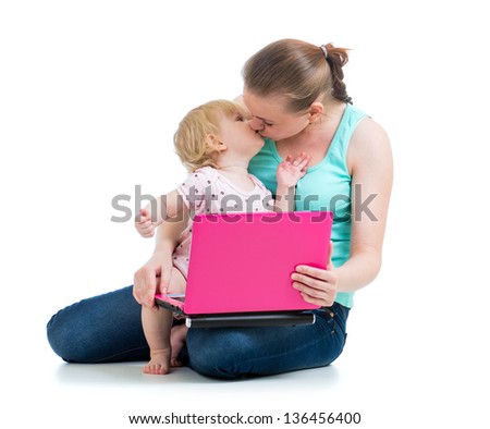 mother and child working at laptop