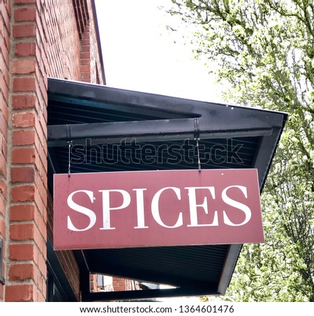 sign displayed at a retail store location with the word spices