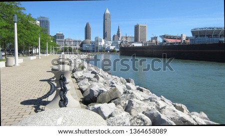 View from the waterfront of Cleveland, Ohio, USA, with tall buildings in the background.
