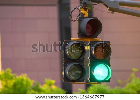 green traffic lights are on. sign that the vehicle can go. -Image