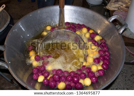 Frying - Quail Egg Snack - It is a snack that is fried in a very hot pan with vegetable oil and palm oil and made with flour-sweet potato-taro-purple.