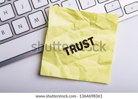 Trust word written in the paper with office