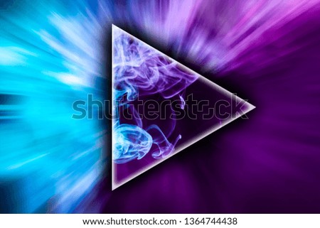 
Colorful pink and blue smoke  in the shape of a triangle on a black isolated background. Background from the smoke of vape
