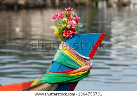 
Images of close-up fishing boats in Thailand Decorated with three colors according to faith