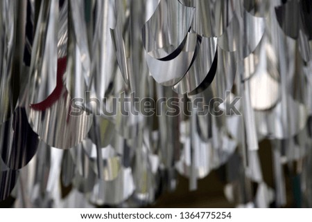Chrome hanging mobile on a ceiling